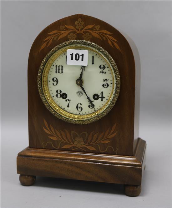 An inlaid dome topped clock
